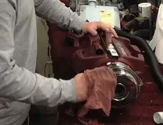 Vacuum repair technician cleaning and servicing a vacuum motor in Memphis, TN
